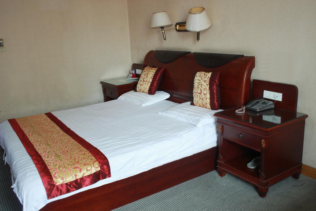 Taizhou Taishan Business Hotel Quarto foto